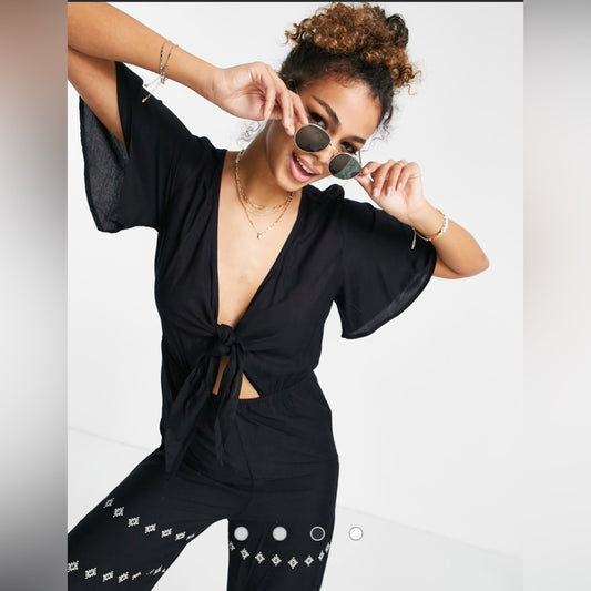 En Crème wide leg jumpsuit with tie front and paisley detail