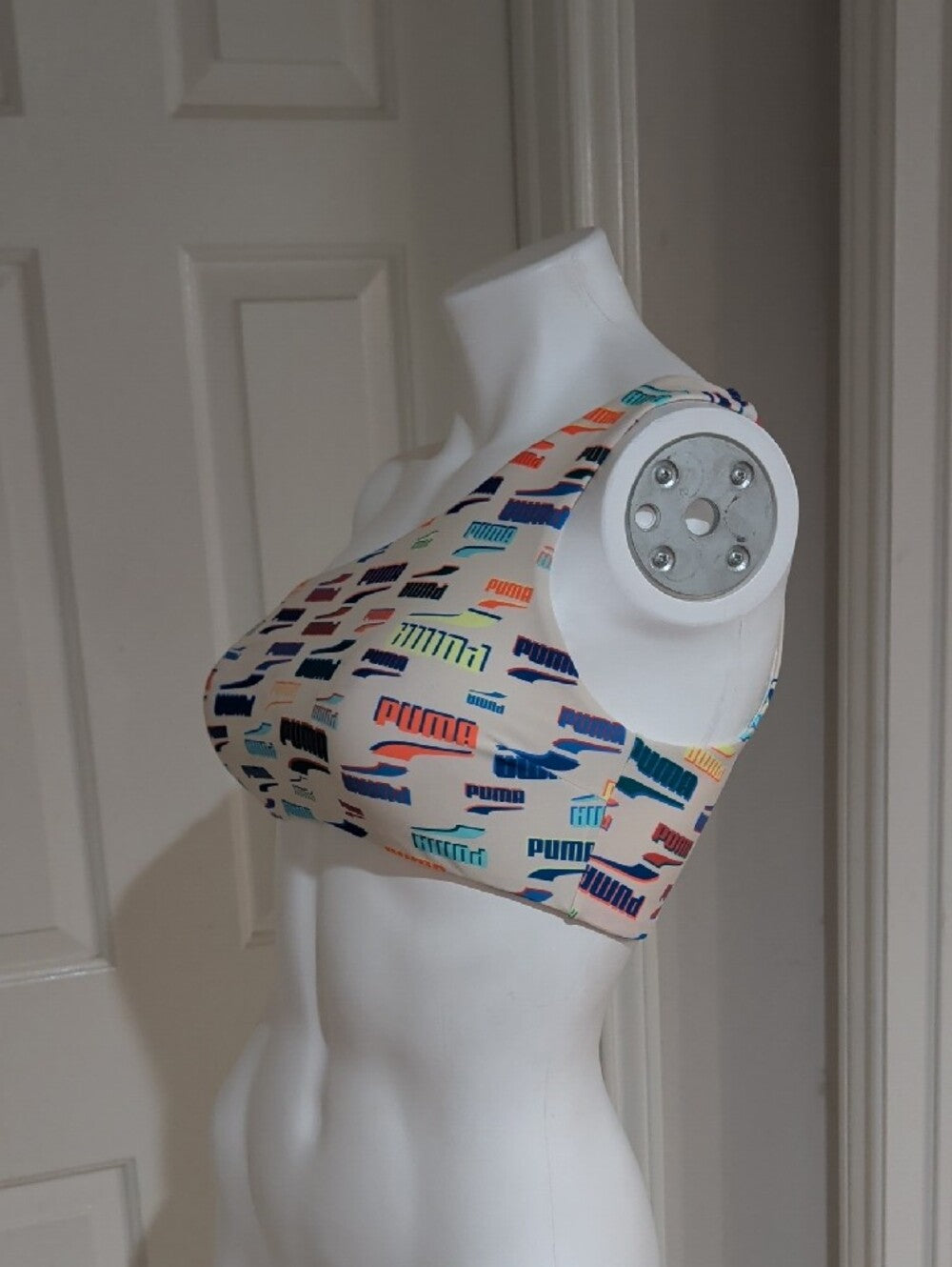 Puma One-Shoulder Sports Bra in Cream with Multicolor Logo Print Women's Medium