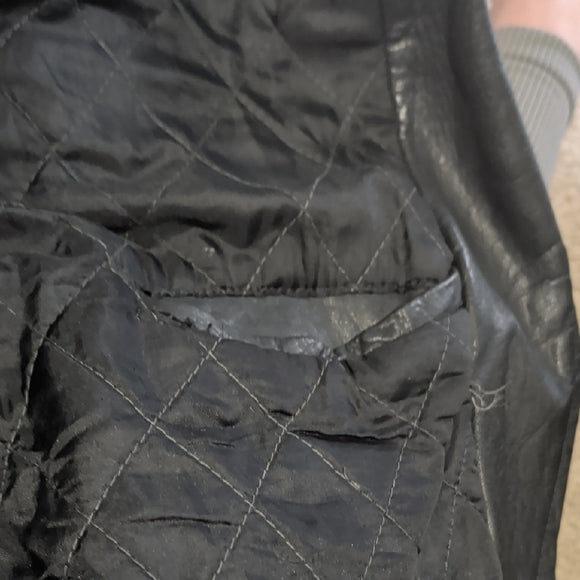 Edgy Black Leather Jacket with Silver Accents Medium