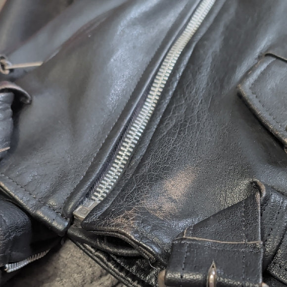 Edgy Black Leather Jacket with Silver Accents Medium